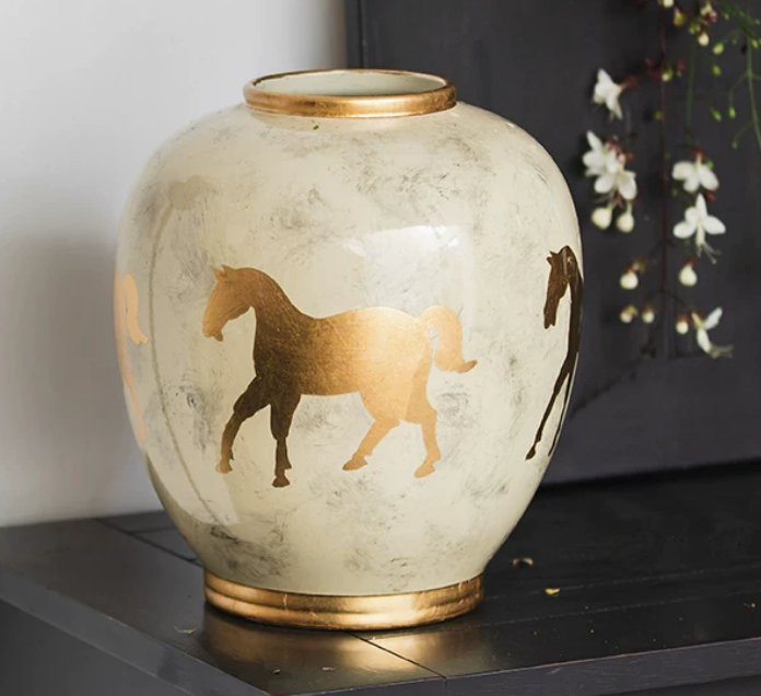 Decorative cream ceramic vase with golden horse motif