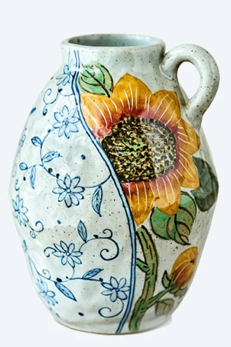 Sunflower Pitcher Vase — oval form with loop handle, relief sunflower