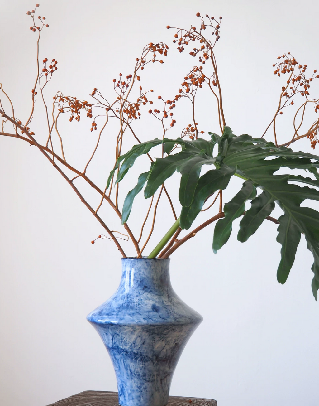 Blue cloud ceramic vase with palm leaf, close view