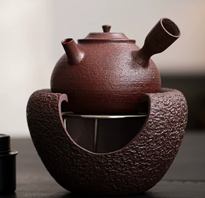 Alcohol stove base interior with flame and metal trivet