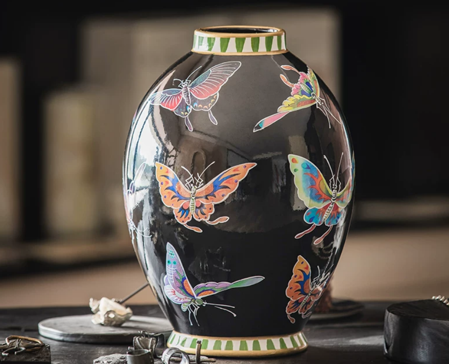 Decorative black ceramic vase with butterfly motif