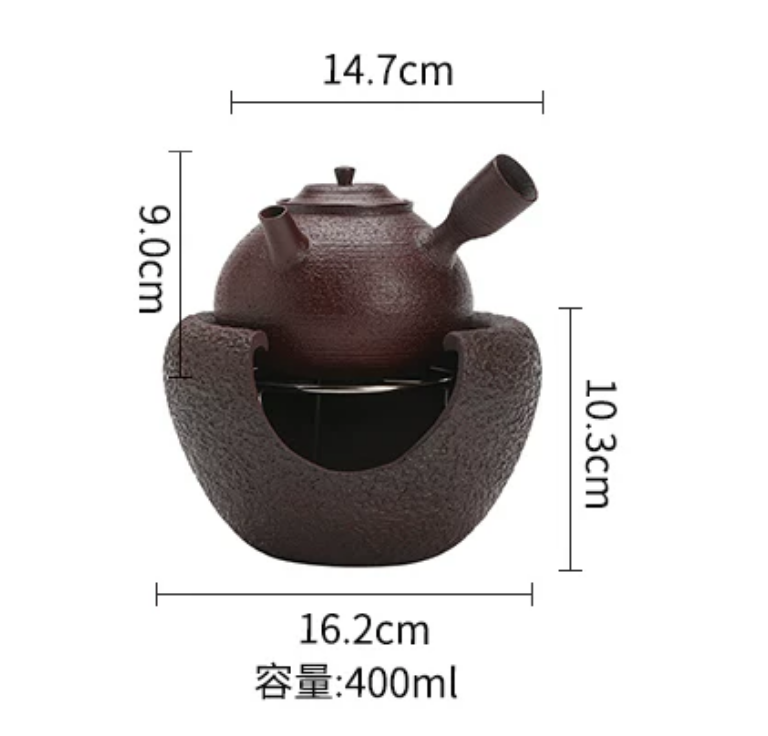 Coarse pottery kettle on alcohol stove base with tea glass